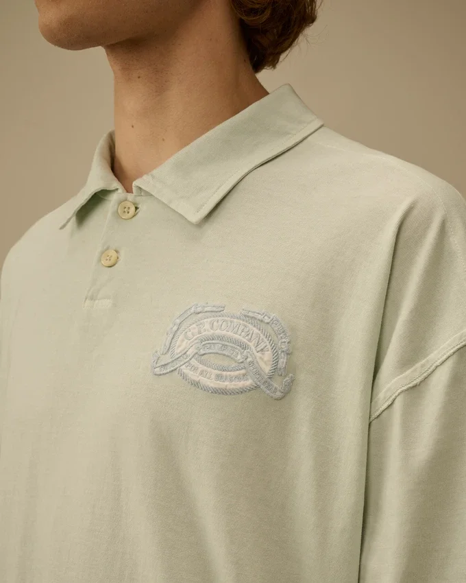 20/1 Jersey Kurzarm-Polo mit kastenförmigem Logo