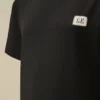 U16 Baumwoll-Jersey 30/1 Kurzarm-Hemd mit Logo-Aufnäher